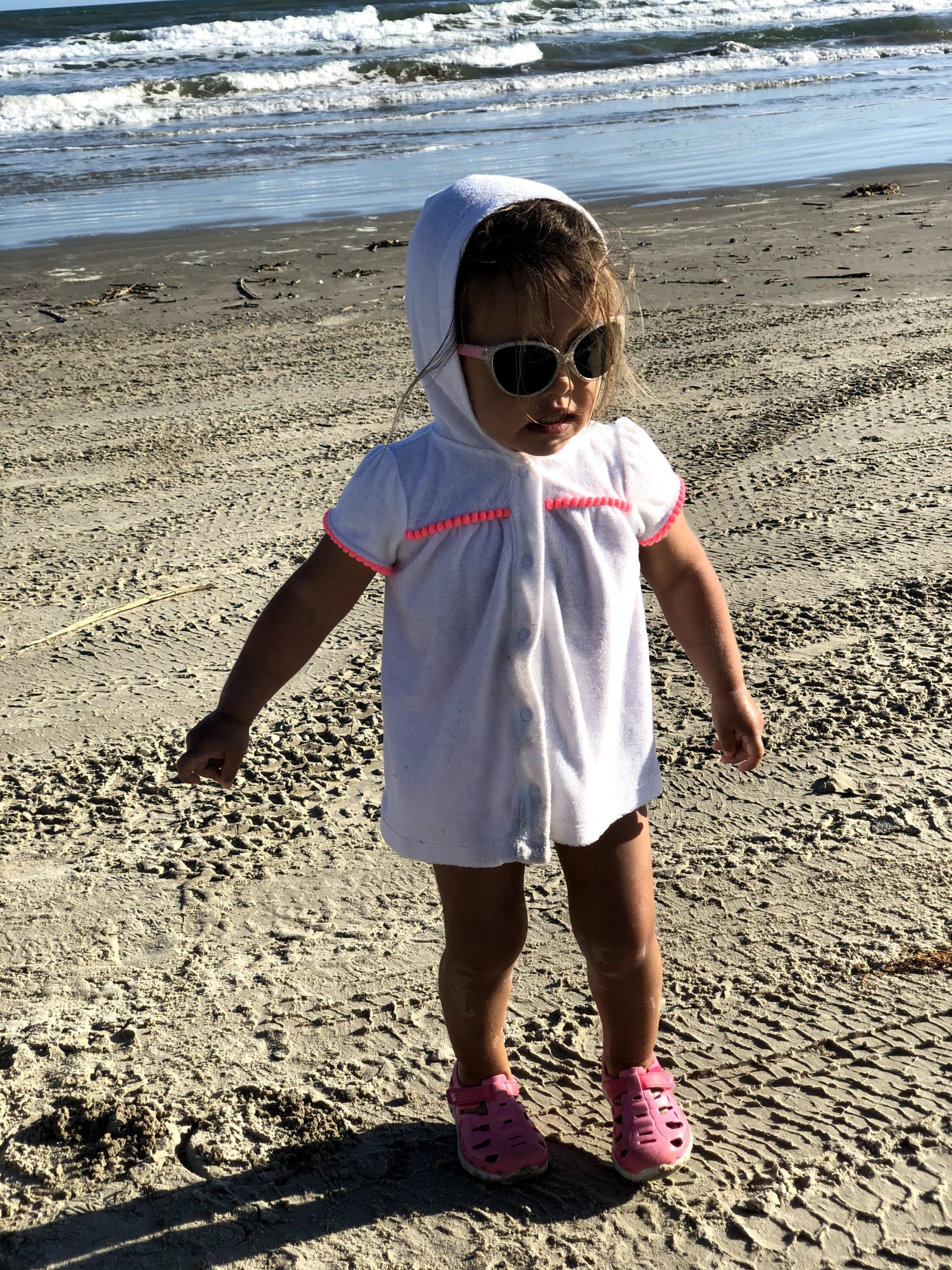 A in her sunglasses on the beach