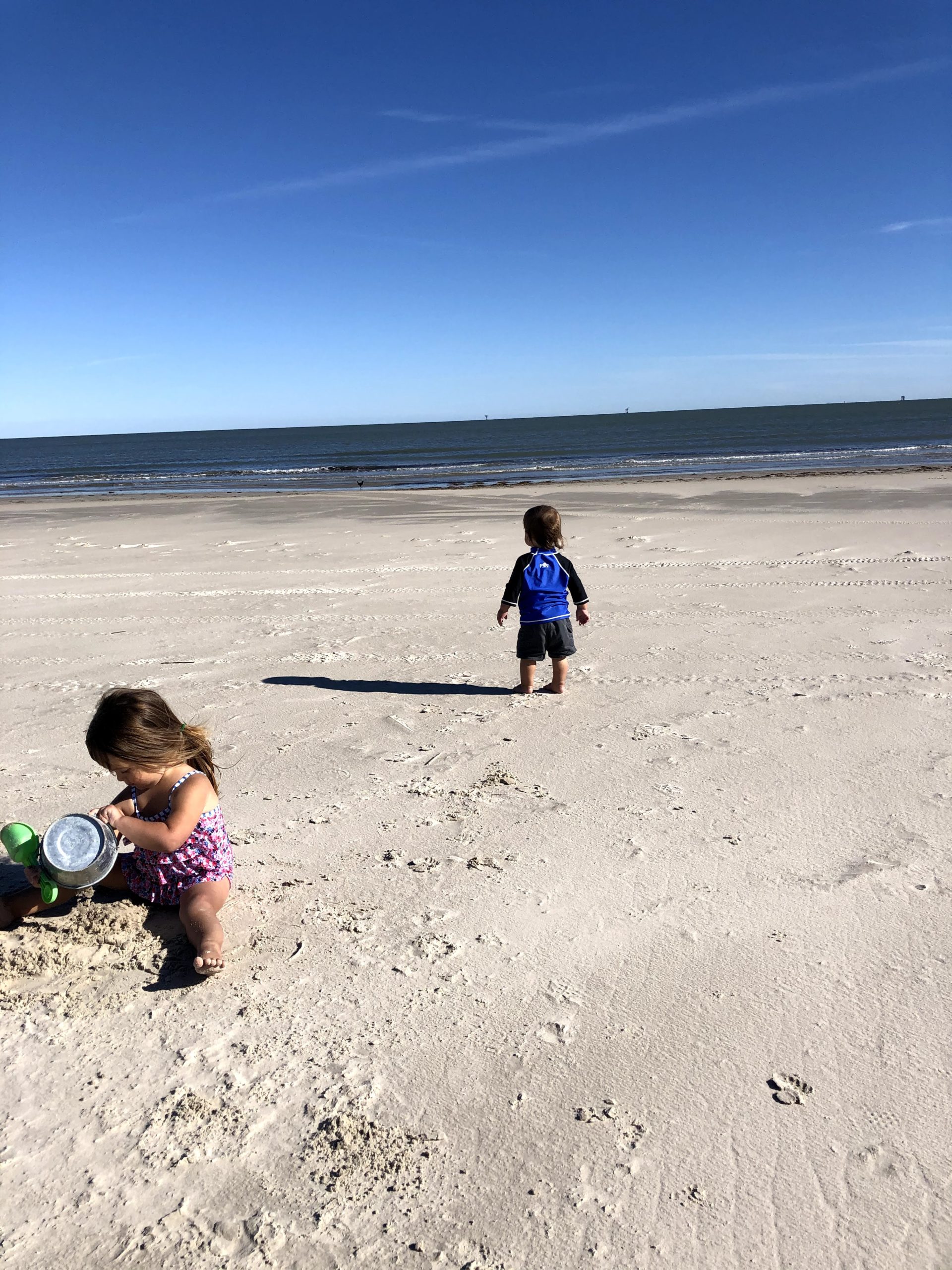 toddlers on the beach