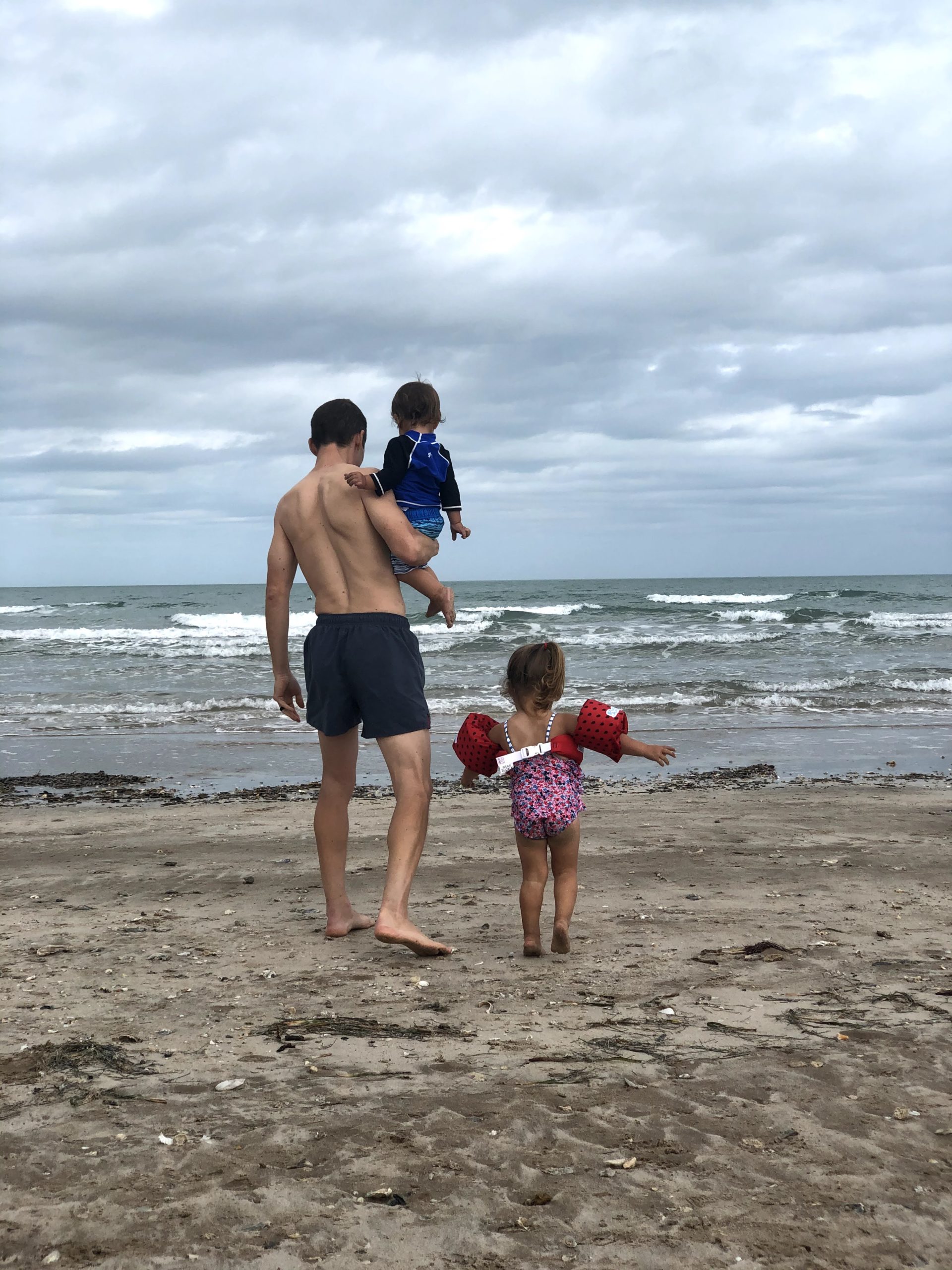John and the kids at the beach